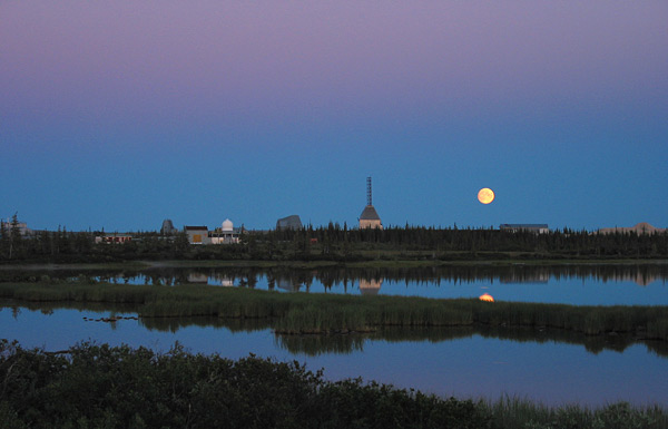 At twilight, the moon hangs over the old Churchill rocket range.