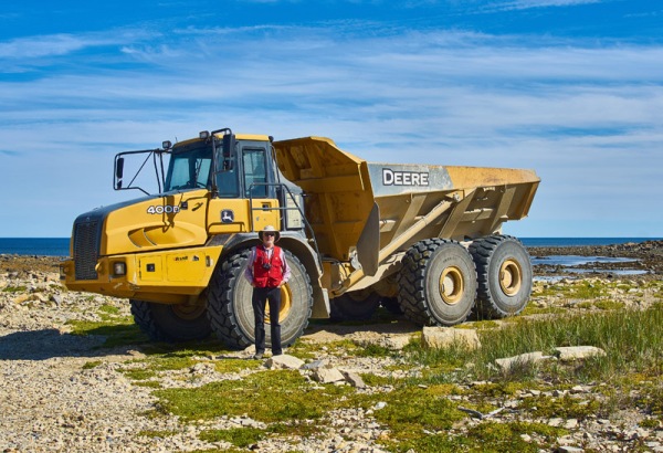 Using specific equipment: me with a quarry truck near Churchill, Manitoba: August, 2016.